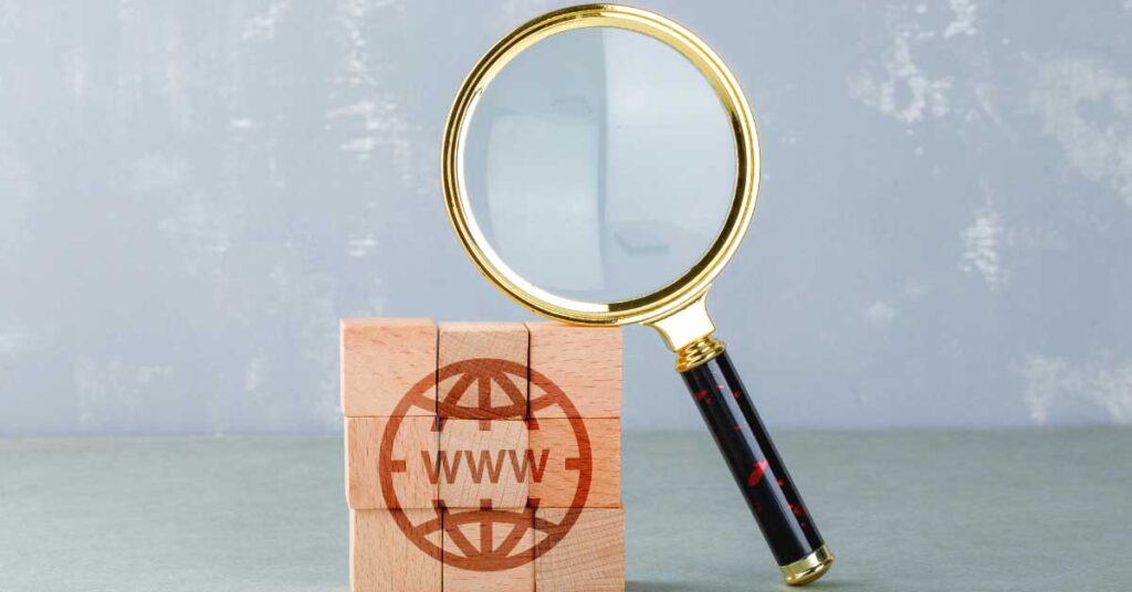 Magnifying glass resting on a domain